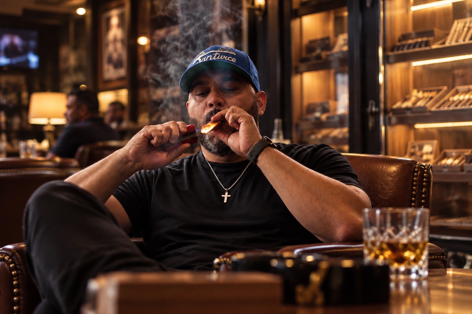 Juan Fernandez Jr., Founder & CEO of The DrawIQ smoking a cigar